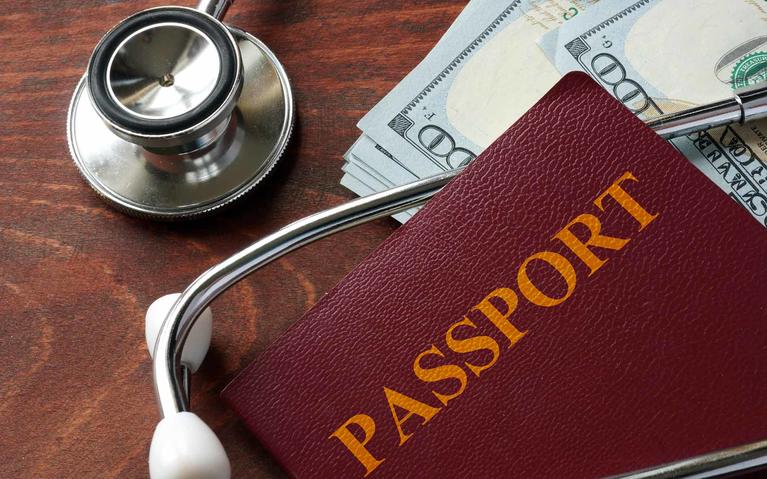 Stethoscope and passport for travel medicine