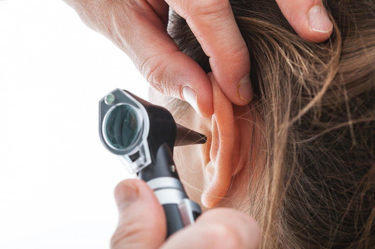 Ear exam with an otoscope