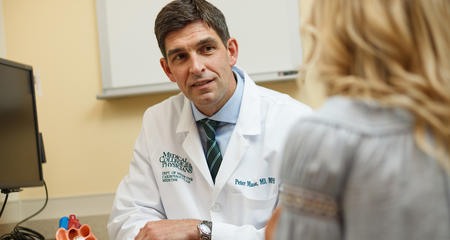 peter-mason-md-cardiologist-with-patient