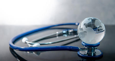 Crystal Globe With Stethoscope (Health Care and Global Warming)