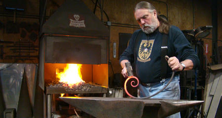 Blacksmith Eric Moebius at his anvil 