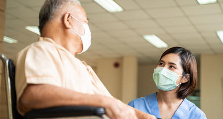 Patient and nurse with masks on