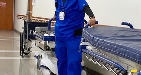 Carlos, Patient Transporter, in scrubs