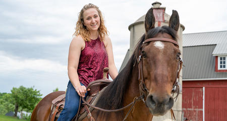 Madeline Pufahl, spine tumor patient, and her horse Jaxun