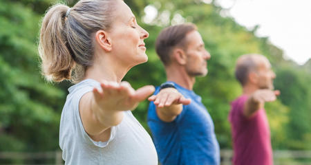 group-people-doing-yoga-breathing-exercises-nature-men-woman