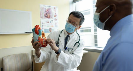 Cardiologist Talking With Patient
