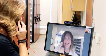Patient and pharmacist on telepharmacy video call