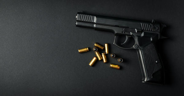 Hand gun on black background